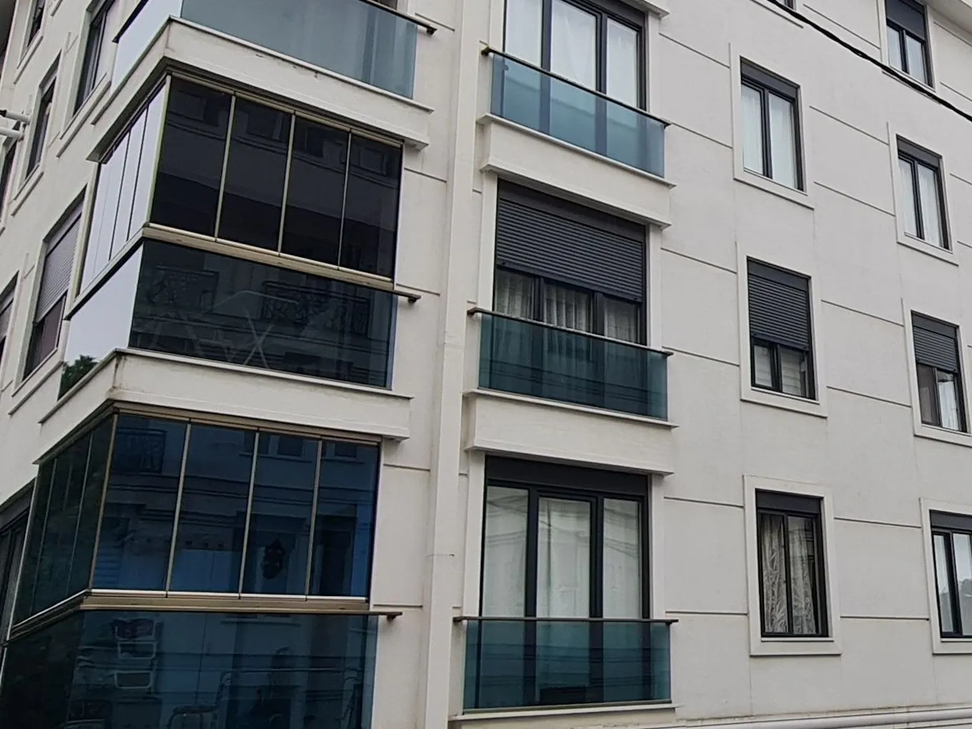 Defne Apartments glazed corner balcony detail